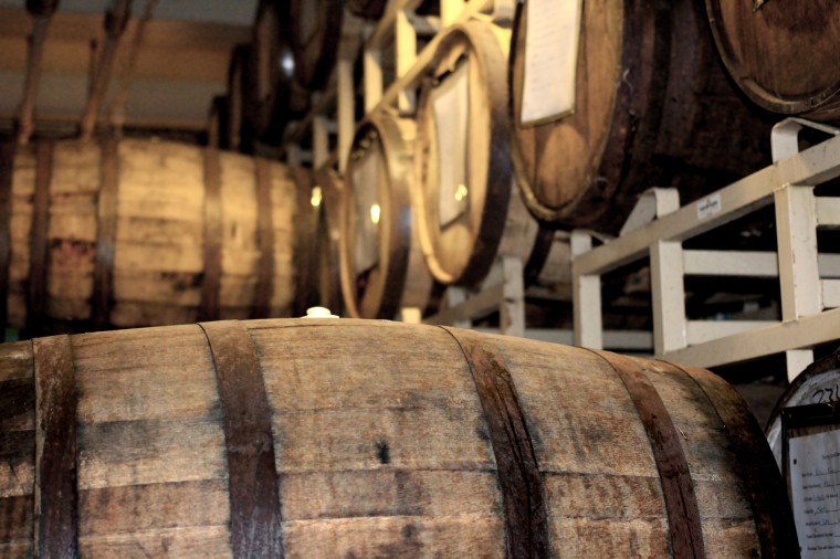 Image of whiskey barrels stored on shelves