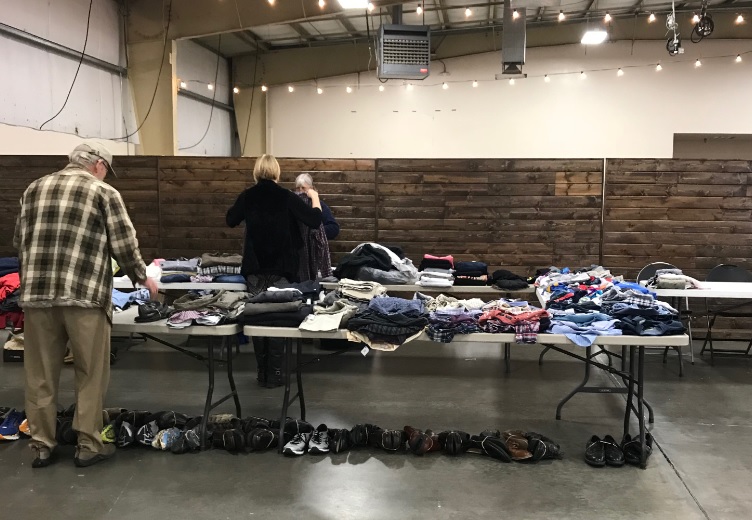 Clothing folded on tables