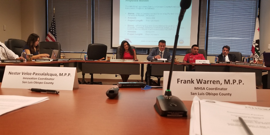 Behavorial Health staff members sitting at a table presenting innovation projects to the state’s Mental Health Services Oversight and Accountability Commission. Click to view article, Innovative New Programs Serve Young Children, LGBTQ Clients