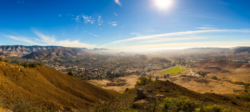 View down into the Valley of San Luis Obispo Click to view article, COVID-19 Cases, Hospitalizations Increase Slightly in SLO County