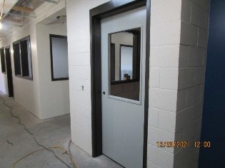 Hollow metal doors/frames and CMU walls painted at interior.