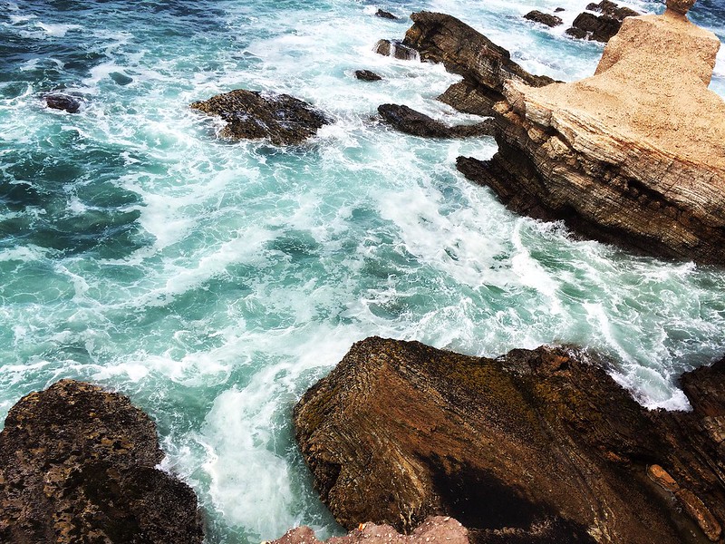Crashing waves below the cliffs at Bluff's Trail in Los Osos
