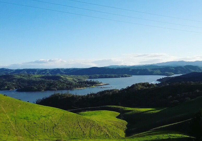 Green hills surrounding a lake
