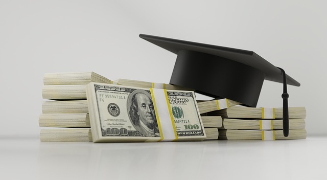 Graduation cap and hundred dollar bills.