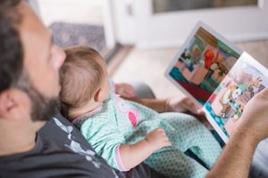 Person reading with baby