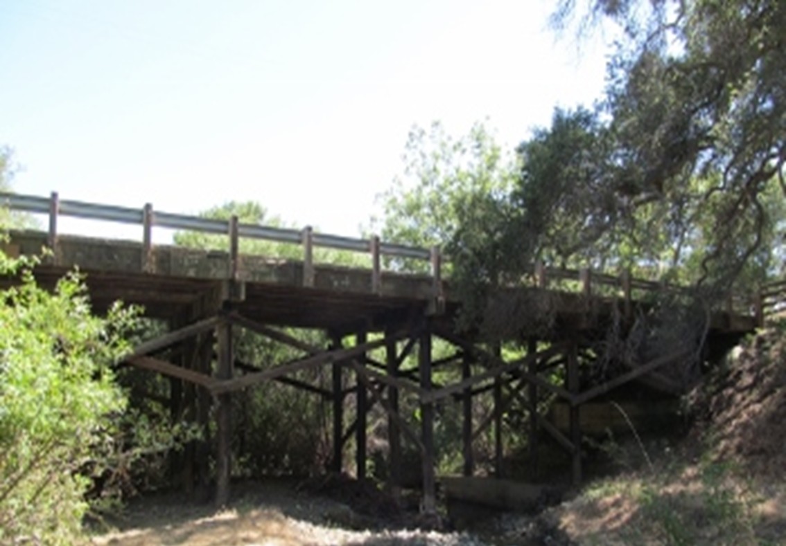 Timber and concrete bridge over Old Creek