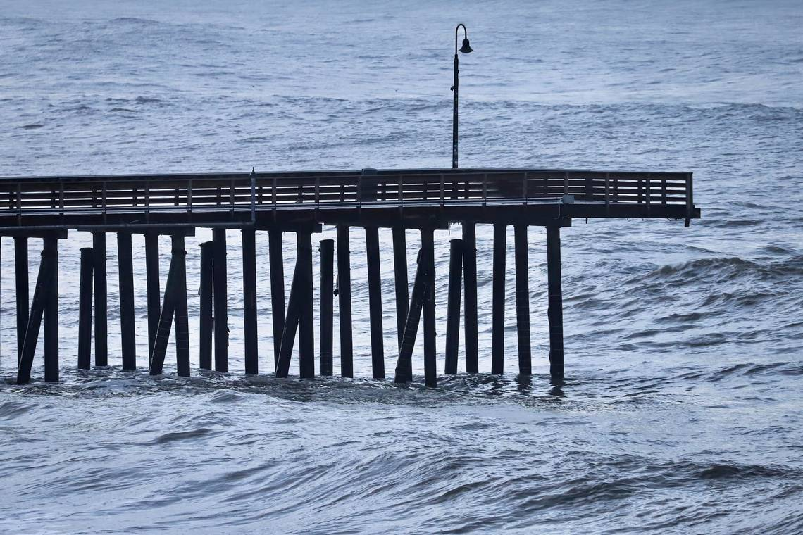 Cayucos Pier from a side view above ocean waves