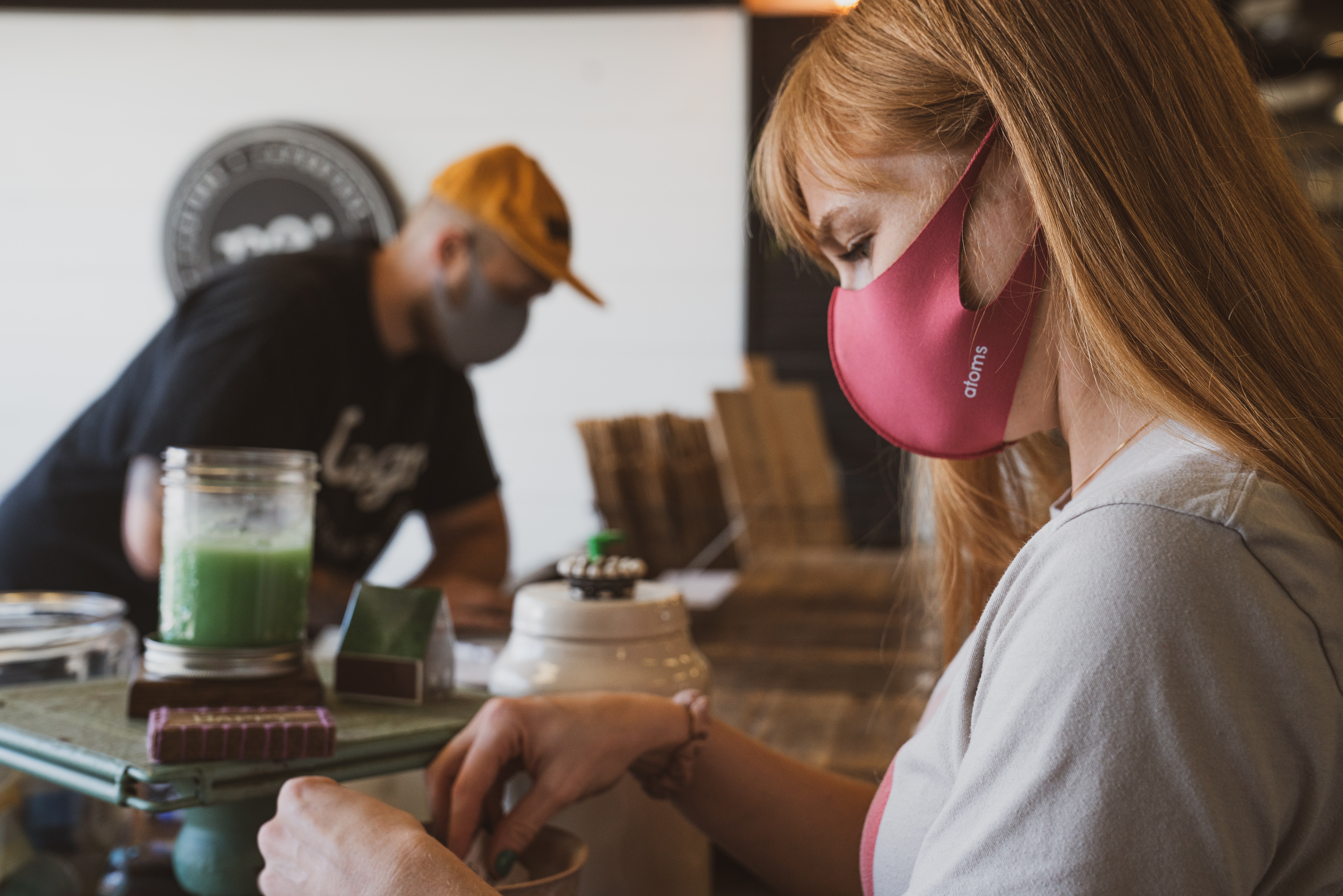 Photo of people wearing masks in a business