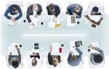 People sitting around table having a meeting