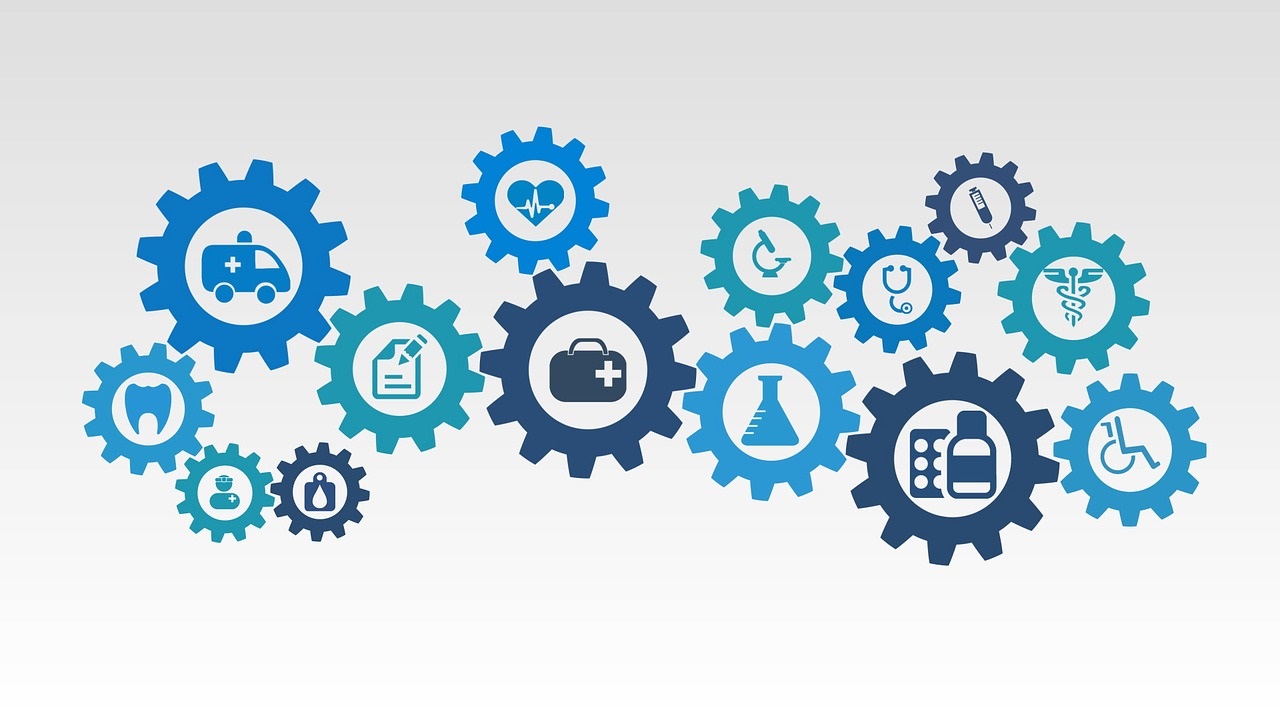 Image showing gears with healthcare icons, such as an ambulance or stethoscope, within each gear.