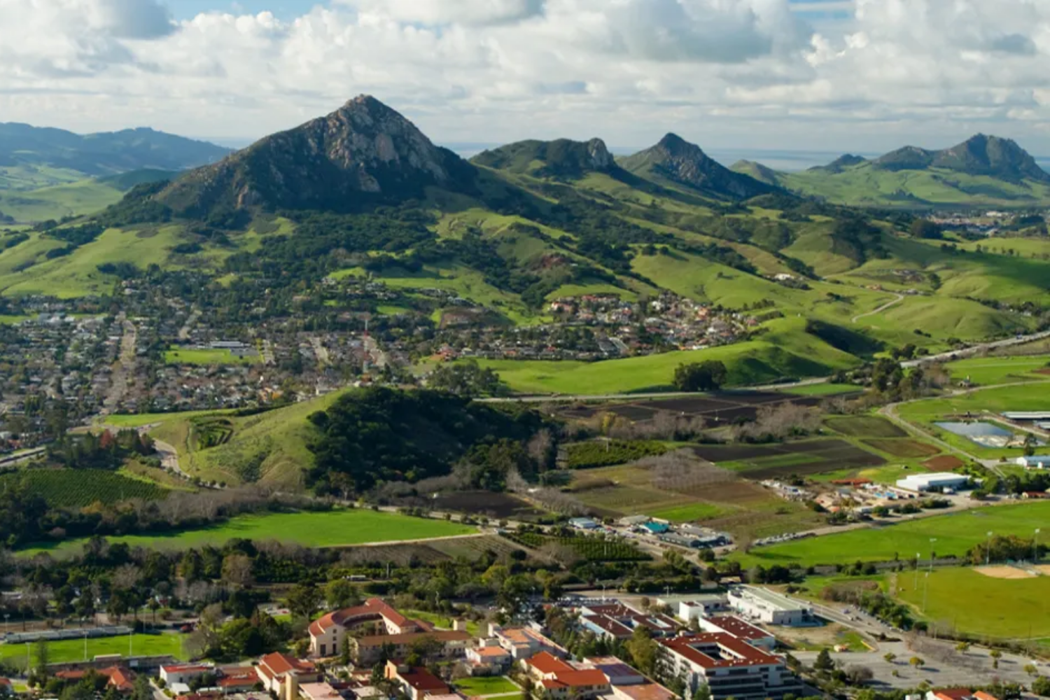 Green peaks behind neighborhoods in the City of San Luis Obispo
