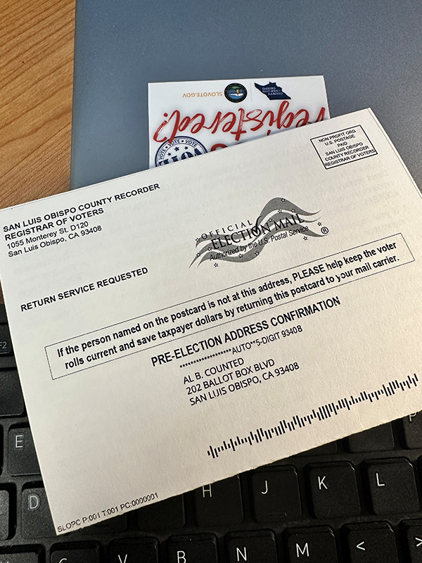 A postcard addressed to a fictional voter with the SLO County Clerk-Recorder's return address