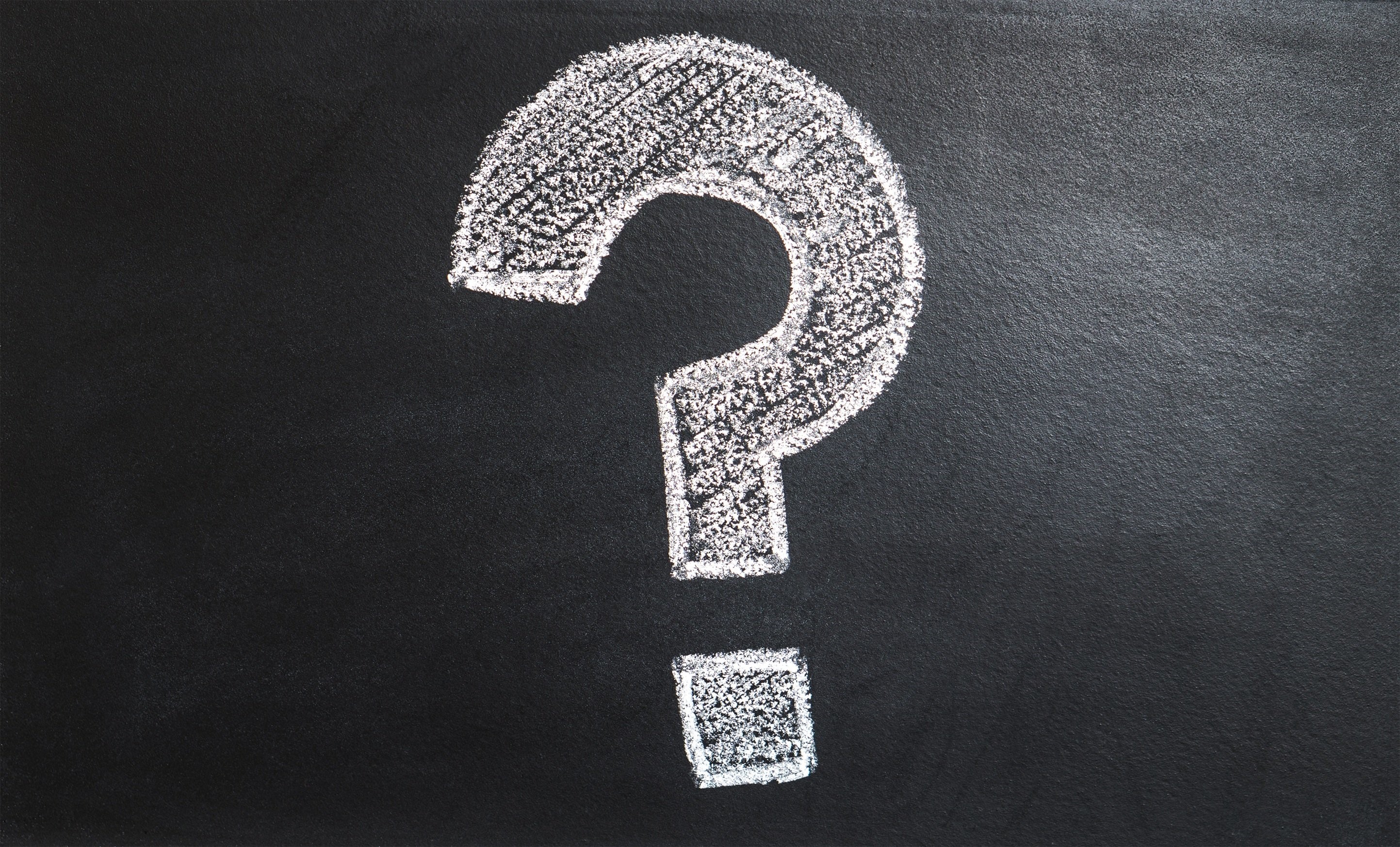 Black chalkboard with with question mark.
